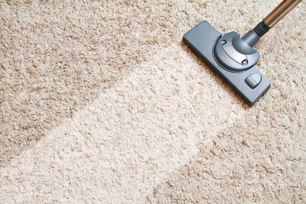 How often should carpets and rugs be cleaned
